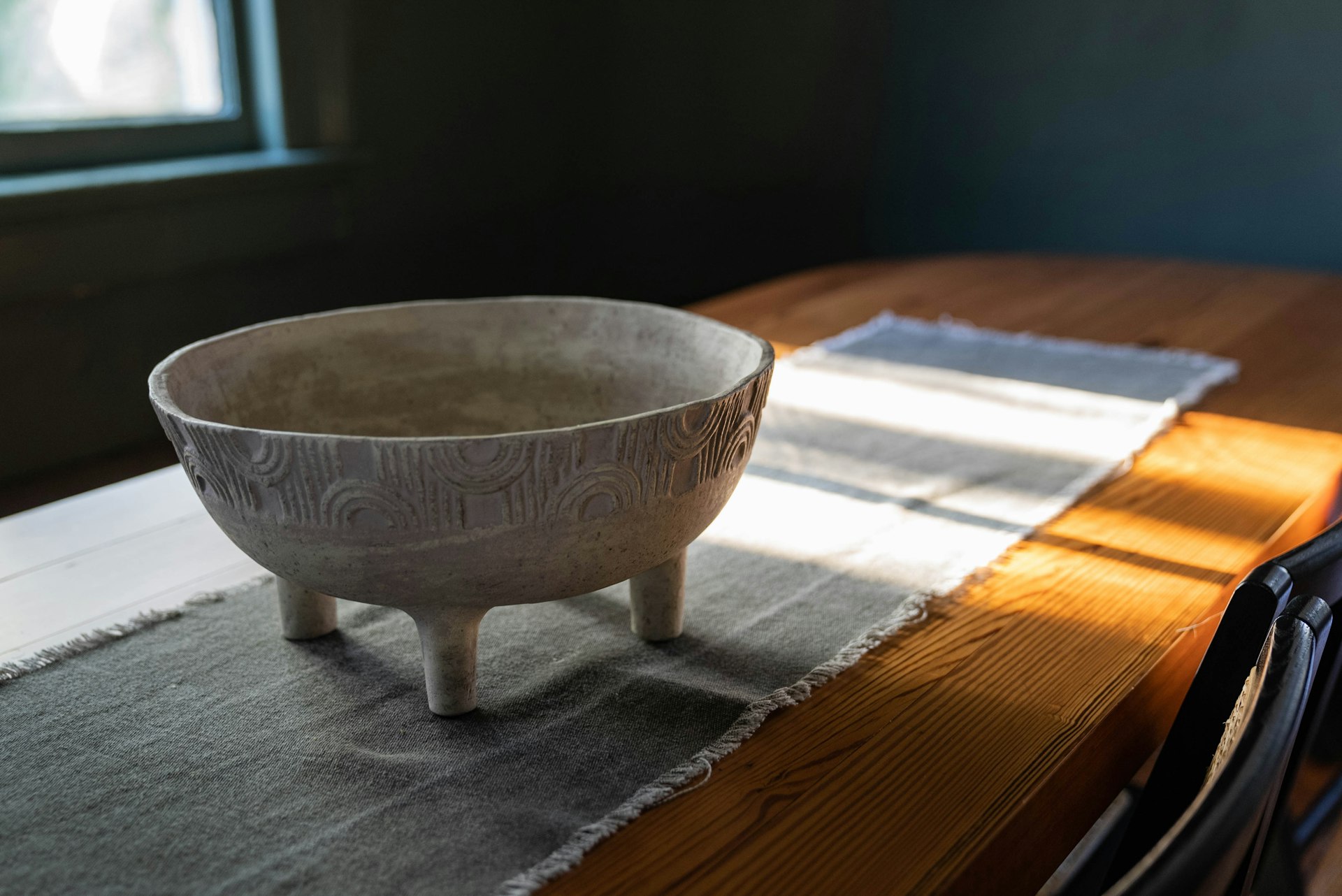 a bowl sitting on top of a wooden table
